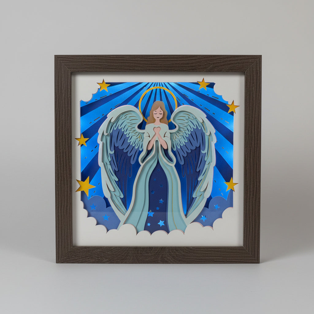 Framed artwork of an angel with wings and stars on a blue background.